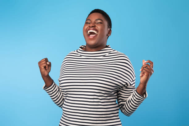 istock Emotional Black Woman Shouting Gesturing Yes In Joy, Blue Background 1434084865
