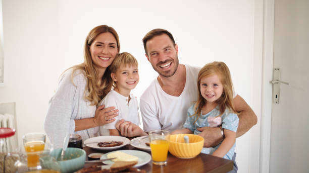 istock Parents with their kids in dining room having breakfast together 1434091009