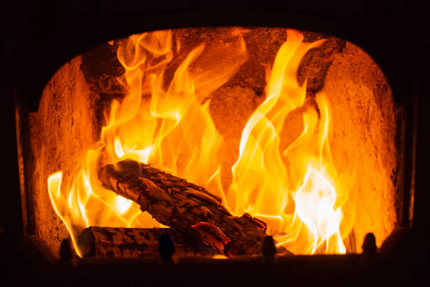 istock Flame of Wooden logs being burn inside stove 1434098227