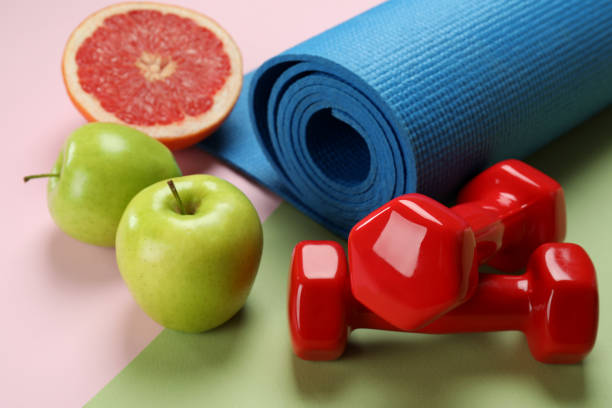 istock Healthy lifestyle accessories on two tone background 1434101764