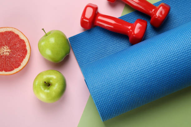 istock Healthy lifestyle accessories on two tone background 1434102681