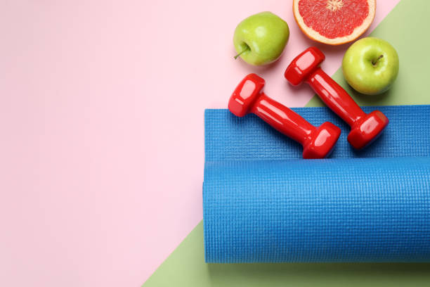 istock Healthy lifestyle accessories on two tone background 1434104940