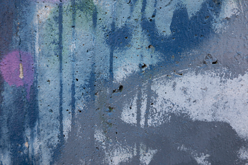 Detail of a graffiti painted on a wall.