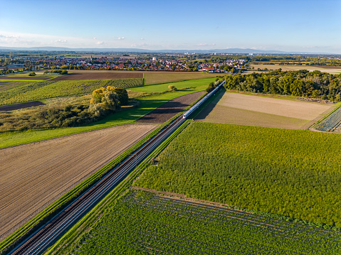 Aerial view of an InterCityExpress on a railway track in rural area, Germany