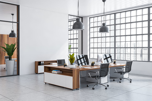 White business interior with armchairs and pc computer on desk, side view, tile concrete floor. Stylish workspace with panoramic window on city view. Mockup empty wall. 3D rendering