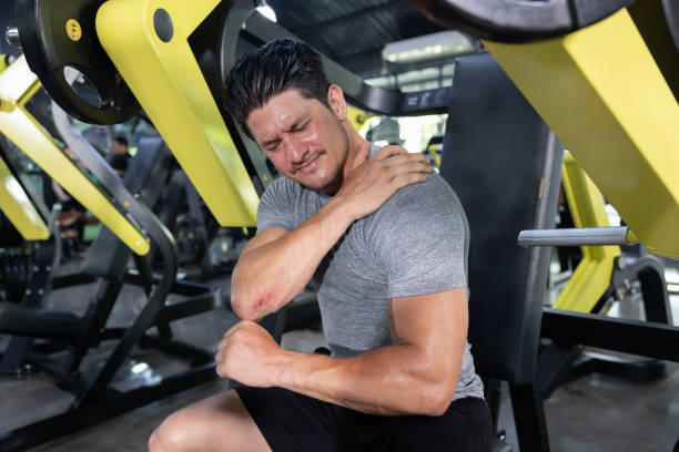 Man Grab His Shoulder with Pain by Shoulder Injured ripl fitness