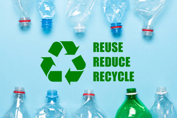istock Recycling symbol and plastic bottles on blue background 1434113310