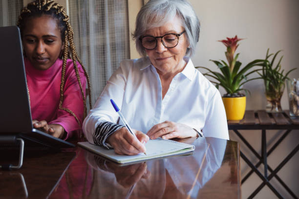 istock Multiracial senior and young business people with working inside home office - Focus on old woman face 1434114889