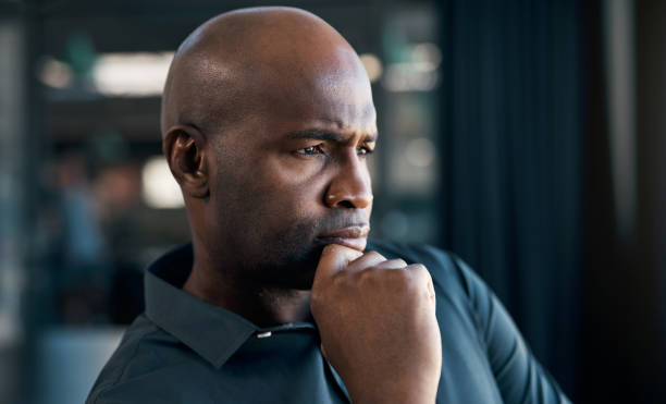 istock Idea, vision and face with a black man in business thinking about future growth and development of his company. Mindset, mission and goal with a mature male employee looking serious closeup 1434116599