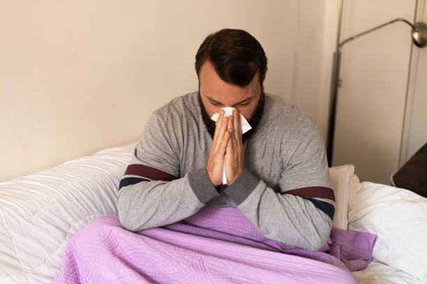 istock A sick man from a virus is at home 1434116651