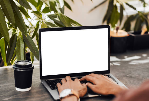 istock Hands typing, coffee and laptop mockup, copy space or advertising, freelancer writing report or online email. Pc, computer and black man working on internet research, web surfing or social media. 1434119037