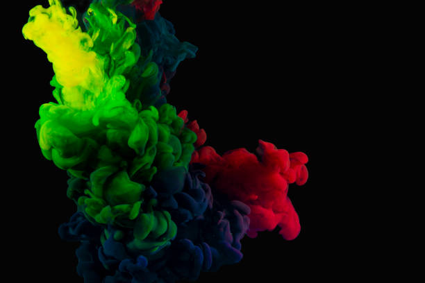 istock Green red and blue inks in water making abstract wallpaper on black banner 1434119495