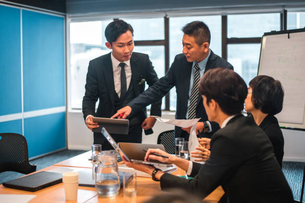 istock Male Boss and Intern Reading Report from Digital Tablet 1434119874