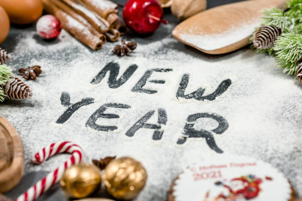 istock Happy New year. Frame of kitchen tools, Christmas decorations gingerbread, cinnamon, Christmas tree on a dark background. Greeting card for the New year. Concept of cafes and restaurants. 1434120004