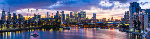 istock London glittering Canary Wharf skyscrapers Docklands developments illuminated sunset panorama 1434120955