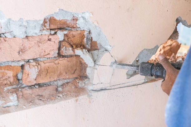 istock Worker use demolition hammer drill to break up wall surface. Motion blur intended. 1434121087