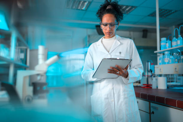 istock Attractive Mid Adult Female Scientist at Work 1434121124
