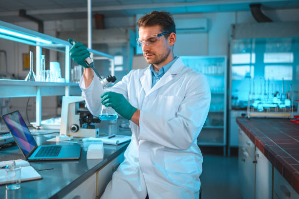 Young Caucasian Scientist Experimenting in the Laboratory stock photo