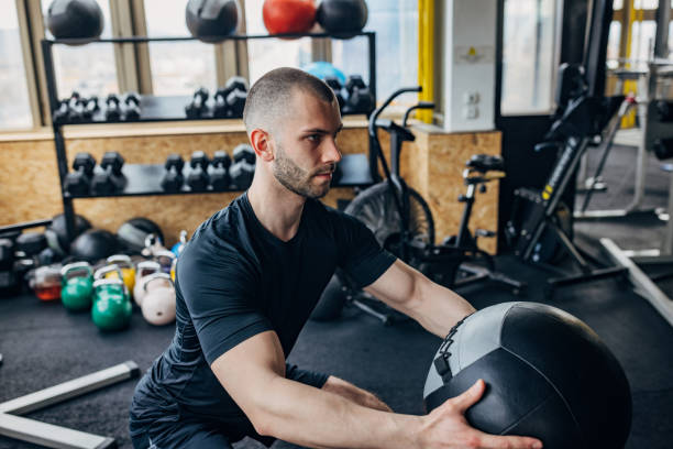 istock Man training with medicine ball 1434123188