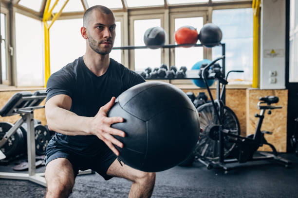 istock Man training with medicine ball 1434123211