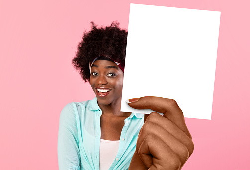 Happy African American Female Holding Blank White Card For Advertisement, Posing Smiling Looking At Camera Standing In Studio Over Pink Background, Showing Good Offer, Collage