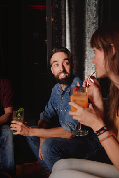 istock friends chatting in a nightclub 1434125624