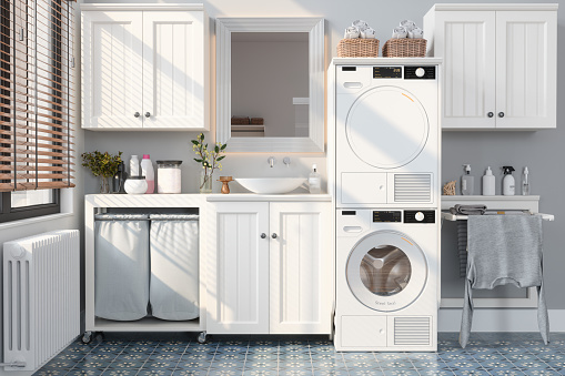 Modern Bathroom With Washing Machine, Dryer, White Cabinets and Drying Rack