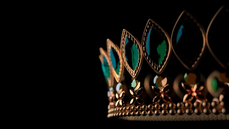 Golden crown with brilliants on black background 3D 4K looped animation with copy space