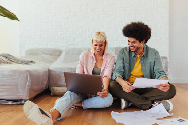 istock Couple settling in new apartment. 1434127125