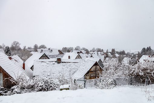 Snow-covered roofs of the houses of the old town in winter