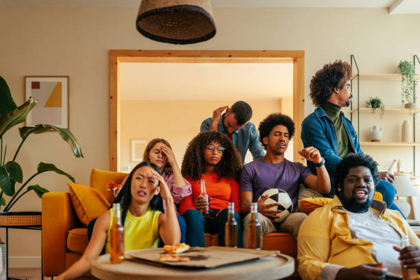 istock Sad friends watching soccer match. 1434128212