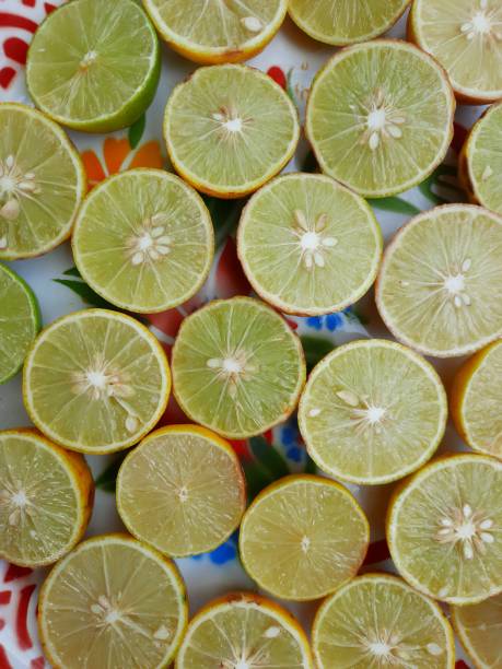 Cutting and squeezing Lemon juice - food preparation.