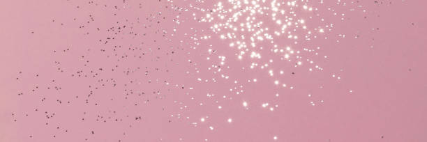 istock Sparkling silver glitter on pink background banner 1434129367