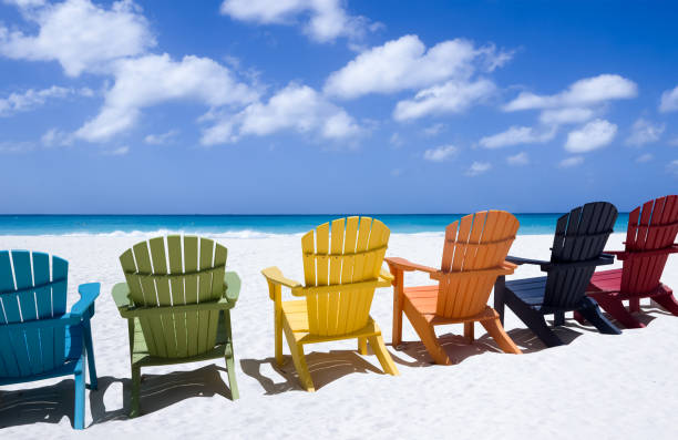 istock Colorful wooden chairs on white sand beach 1434129606