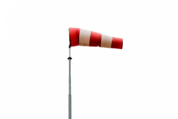 Red wind flag (windsock) in calm conditions with blue sky background Wind sleeves show wind direction and speed. Windy weather concept.