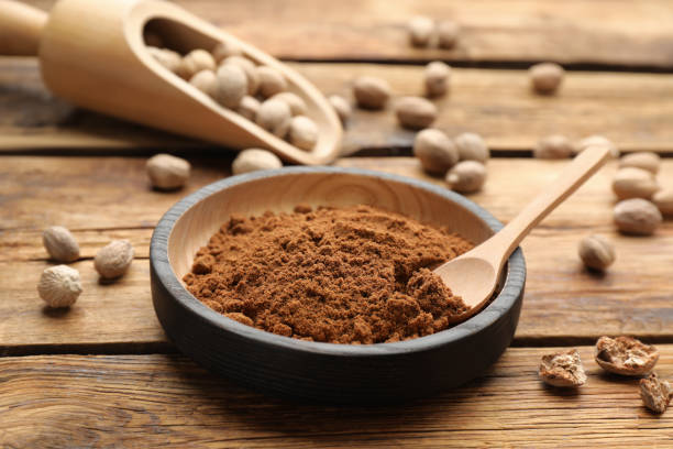 istock Ground nutmeg and scattered seeds on wooden table 1434130682