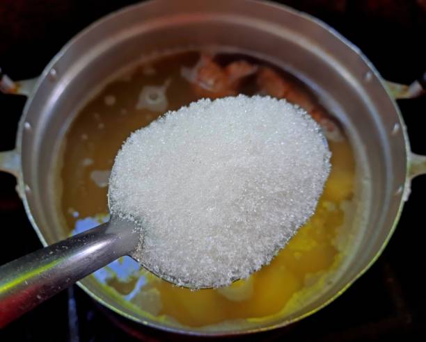 istock Adding White Sugar in Boiling Sweet Potato dessert - Thai Dessert preparation. 1434131367