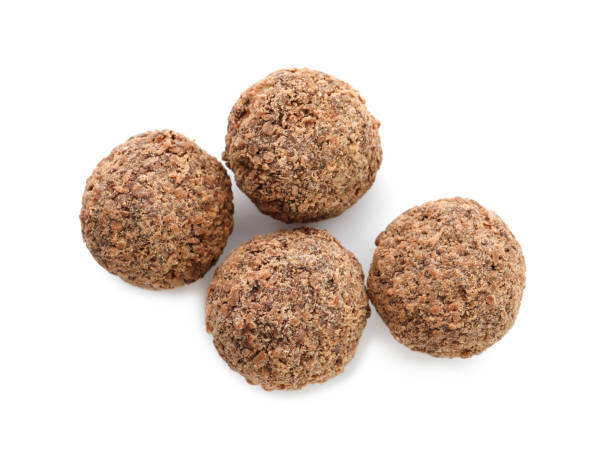 istock Delicious chocolate truffles on white background, top view 1434131391