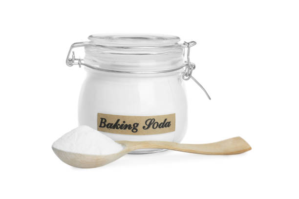 istock Spoon and jar with baking soda on white background 1434131712