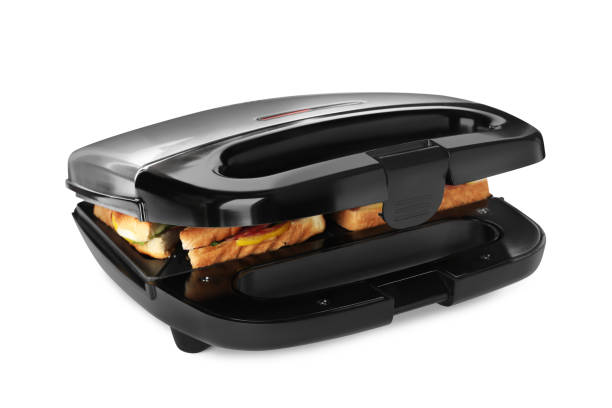 moderner grillmaker mit sandwiches auf weißem hintergrund - getoastet stock-fotos und bilder