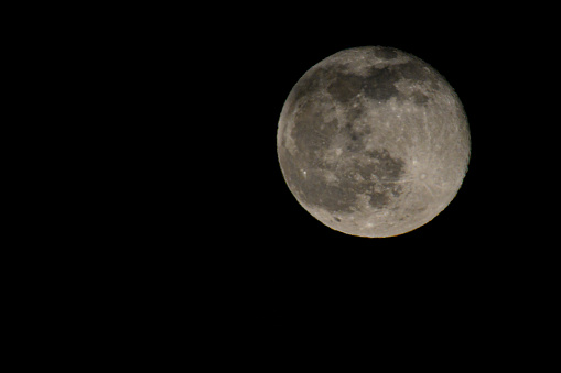 Full Moon in the dark February winter night sky in Overijssel, The Netherlands.