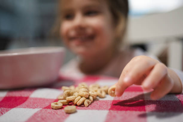 istock Toddler girl having cereal for breakfast 1434132637