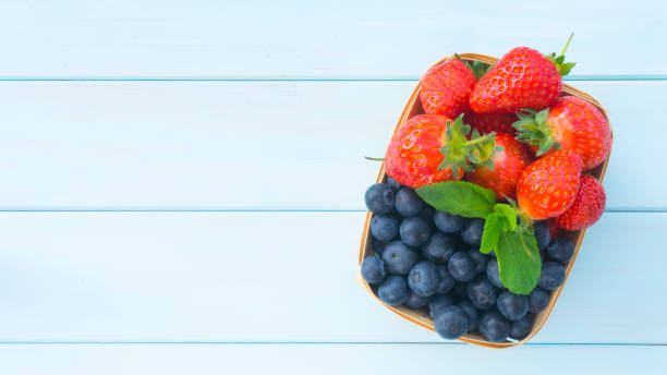 istock Basket with fresh strawberries and blueberries 1434132638