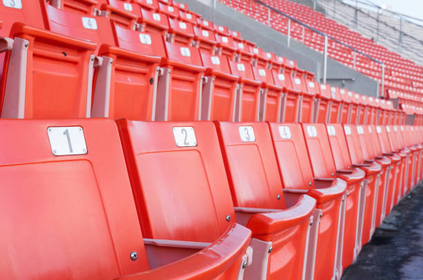 istock Empty orange seats at stadium,Rows of seat on a soccer stadium 1434132833