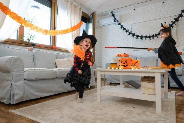 istock Sisters playing in the house during Halloween dressed as witches 1434132889