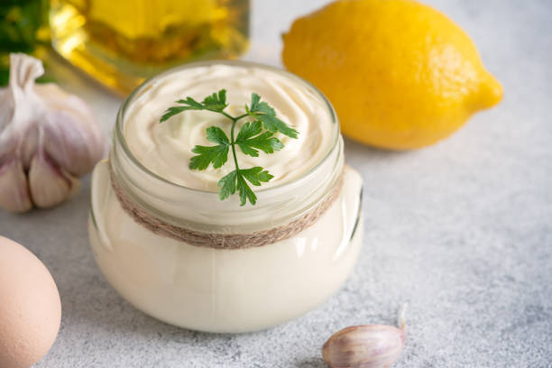 istock Aioli sauce close-up on a light rustic background. Side view, selective focus. 1434136929