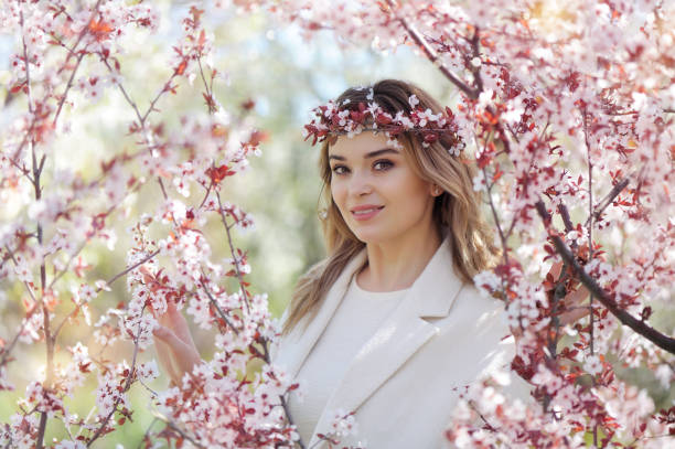 istock Beautiful woman wearing cherry bloom wreath on head 1434137926