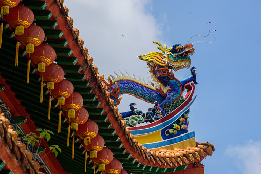 The Bright colors ornate dragons on the roofs of The Thean Hou Temple in Kuala Lumpur