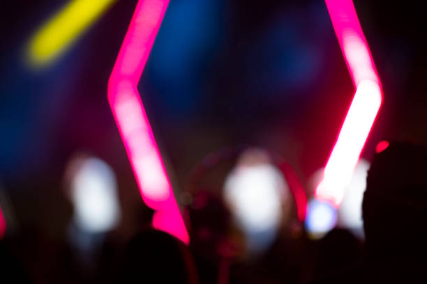 istock Bright pink stripes of optical bokeh on a dark background. 1434141458