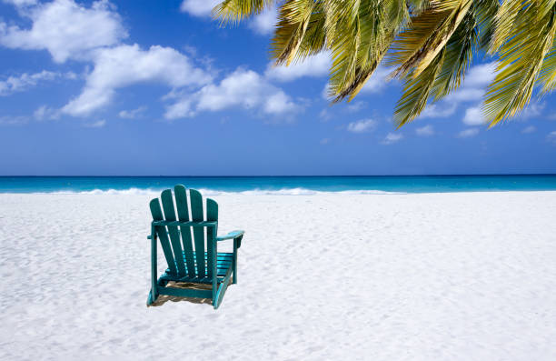 istock Colorful wooden chairs on white sand beach 1434143128